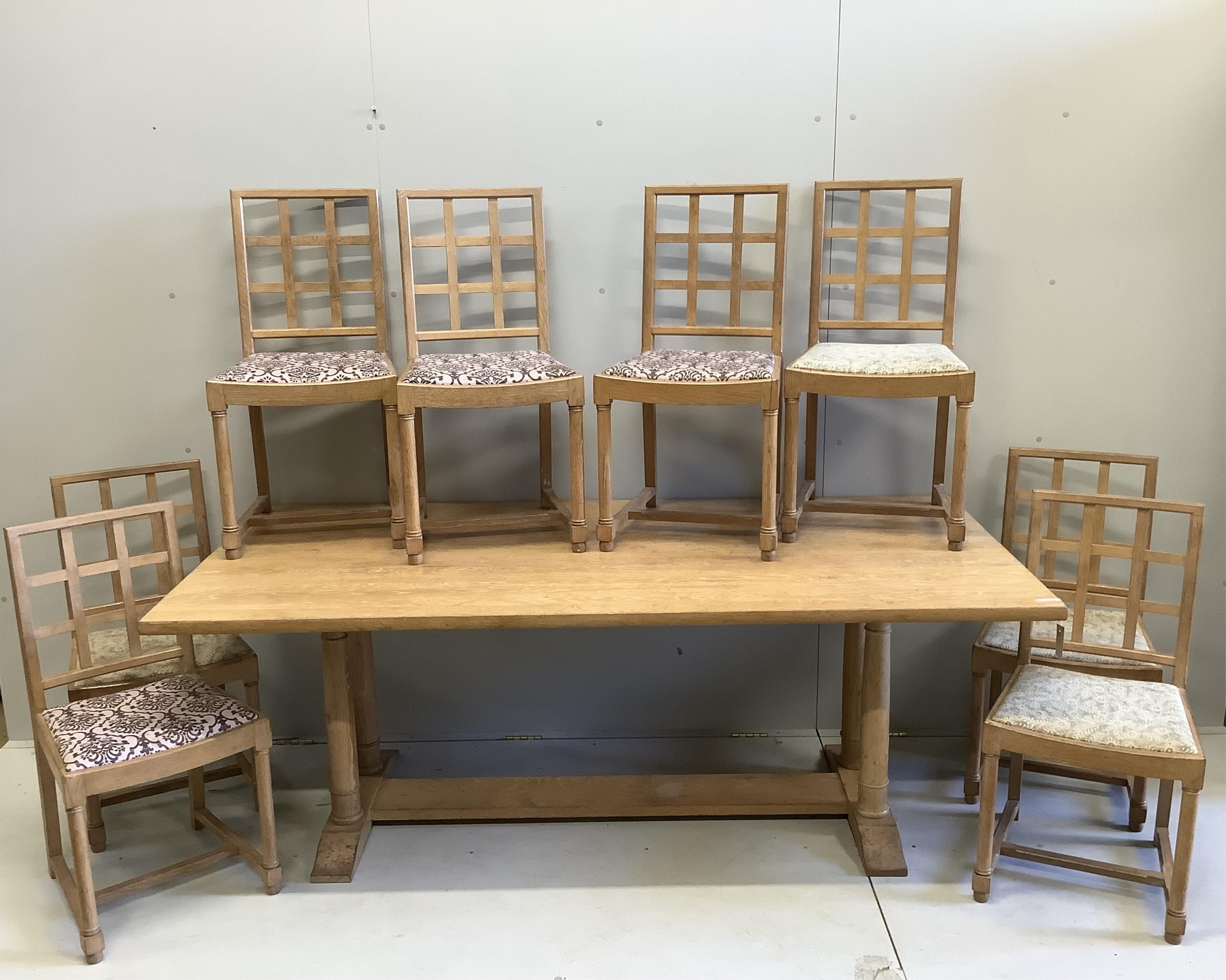 A Sir Ambrose Heal design rectangular light oak refectory dining table, width 197cm, depth 90cm, height 74cm, and eight dining chairs. Condition - fair